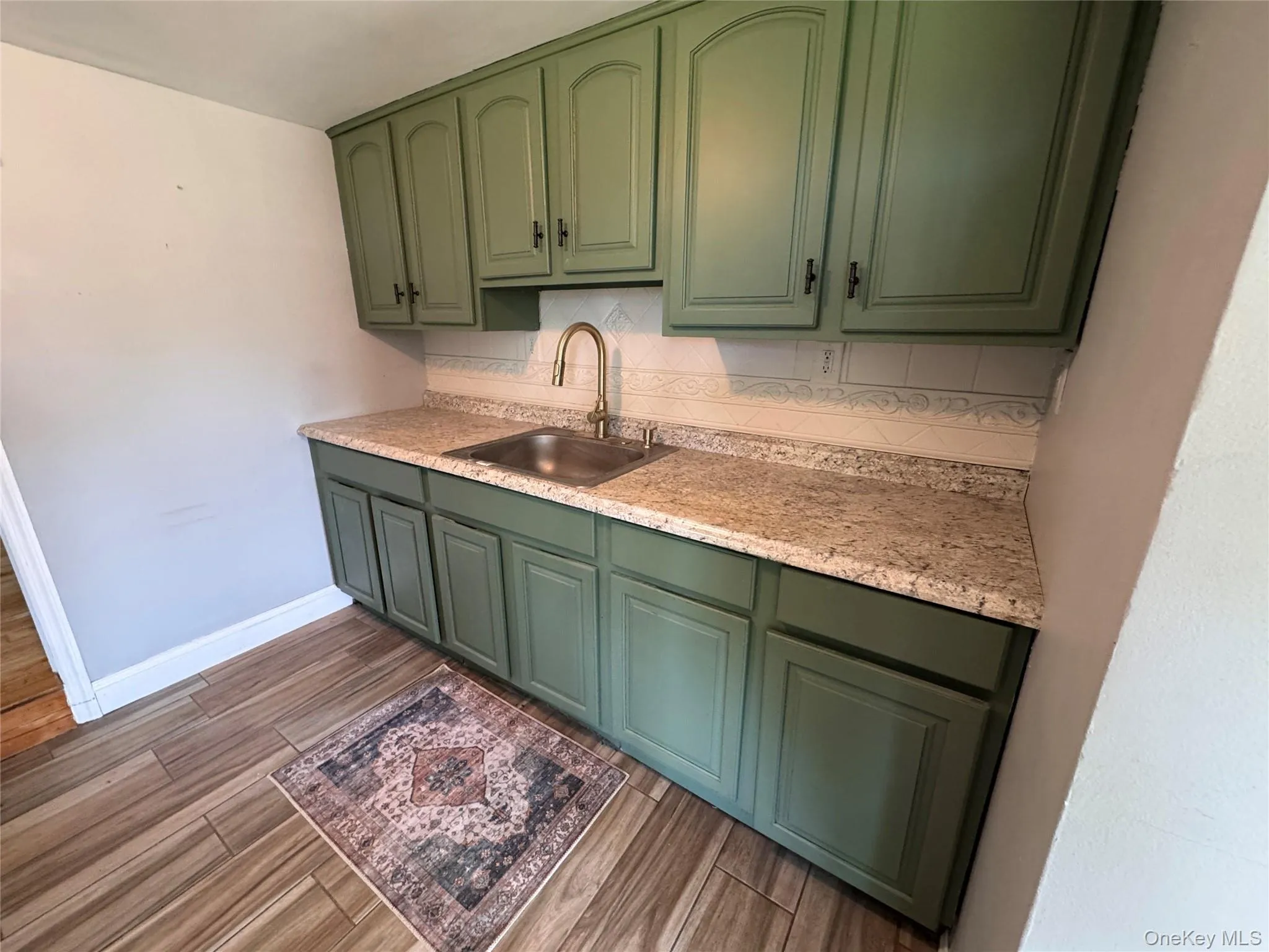 Cabinet area and sink. Cabinet area and sink.