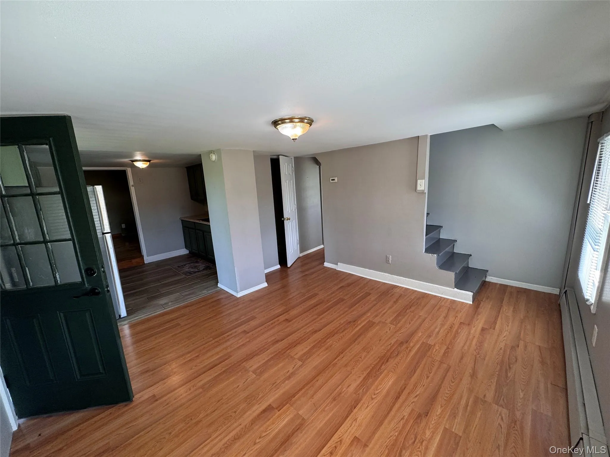 Living Room/Dining Room area with staircase up to second floor bedroom ., Living Room/Dining Room area with staircase up to second floor bedroom .,