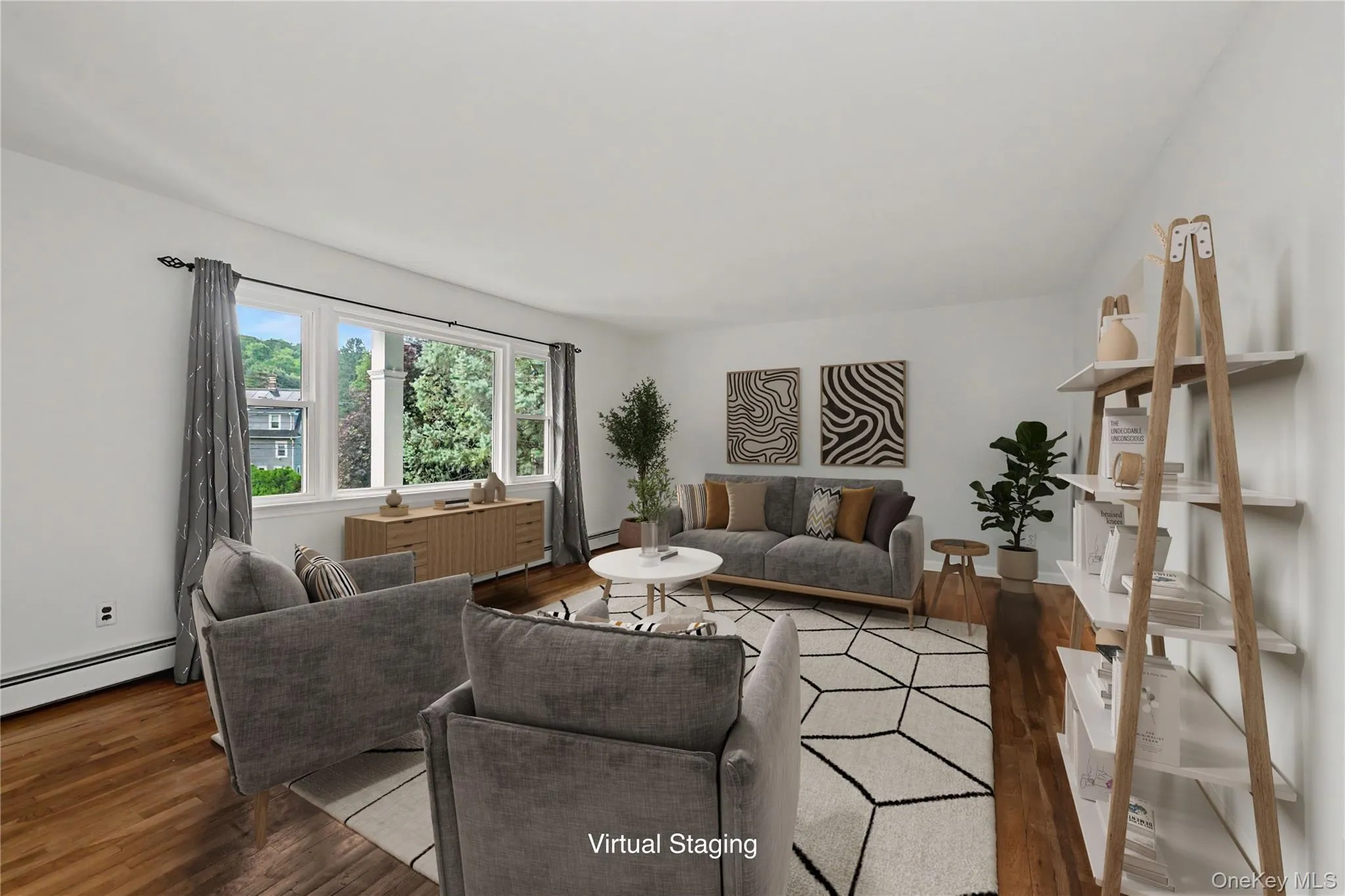 Virtually staged Light-filled living space featuring wood-finish flooring, white walls, and a multi-pane window Virtually staged Light-filled living space featuring wood-finish flooring, white walls, and a multi-pane window