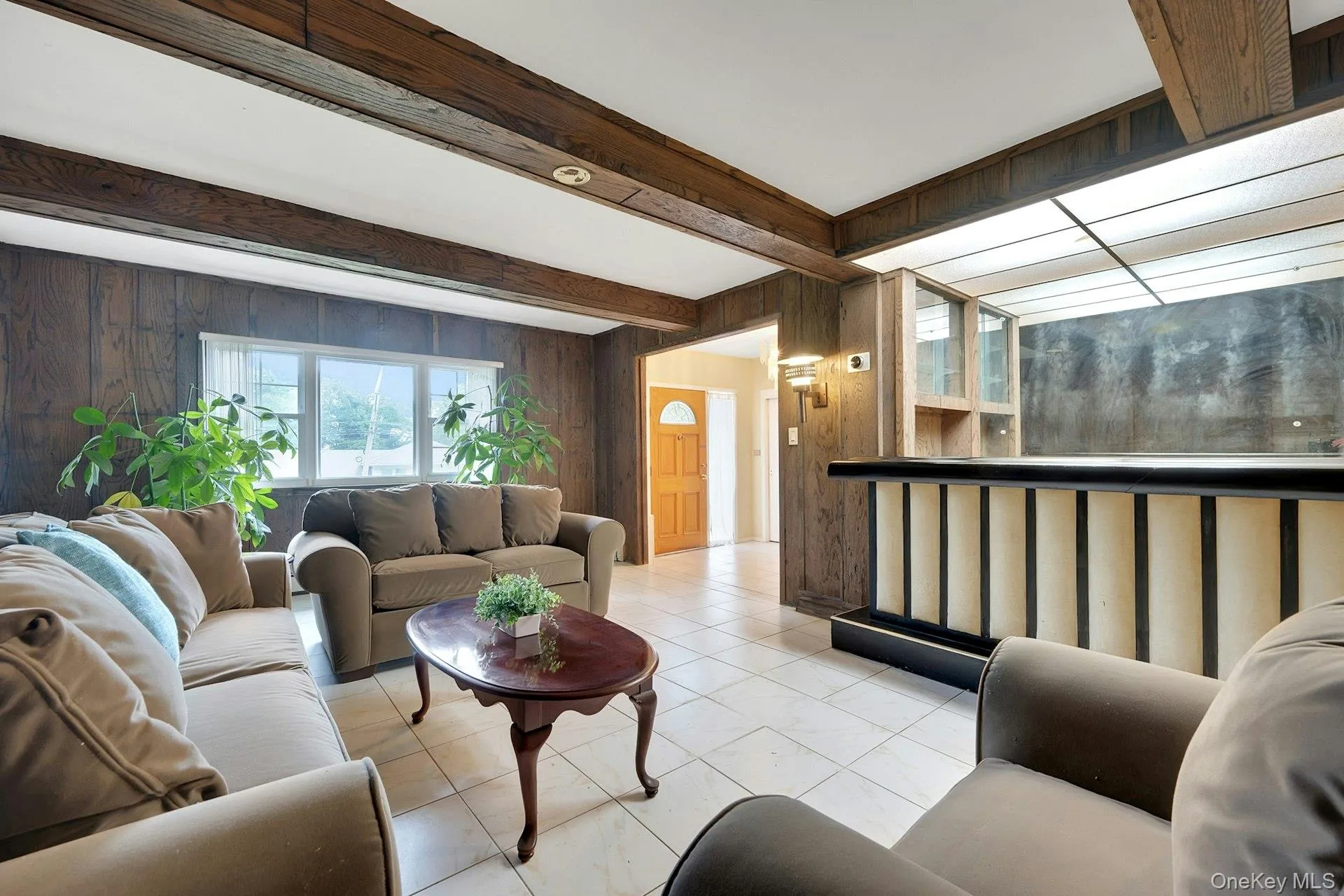 Family room with built-in bar and view toward front door Family room with built-in bar and view toward front door