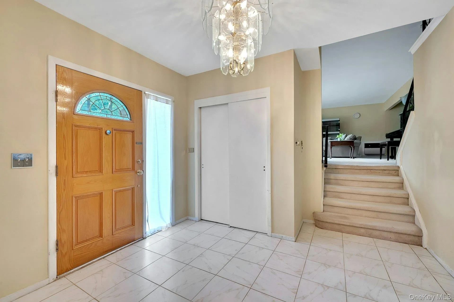 Large foyer leading to family room, full bathroom, laundry Large foyer leading to family room, full bathroom, laundry