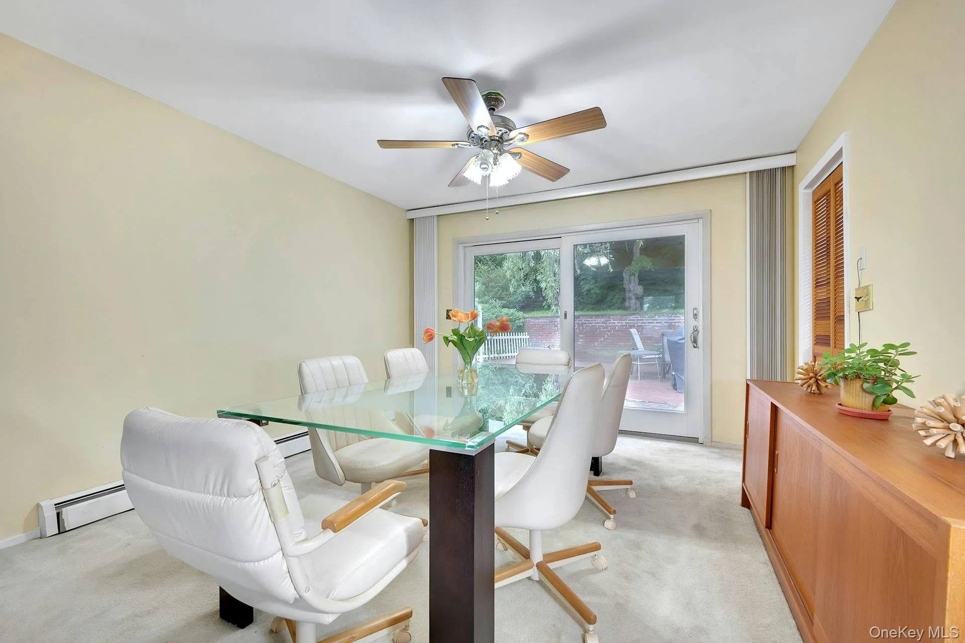 Spacious dining room with sliding doors to backyard patio Spacious dining room with sliding doors to backyard patio