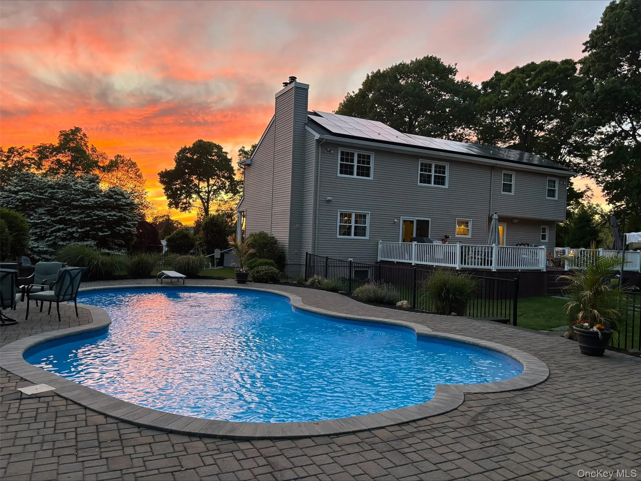Featuring the pool and sunset view Featuring the pool and sunset view