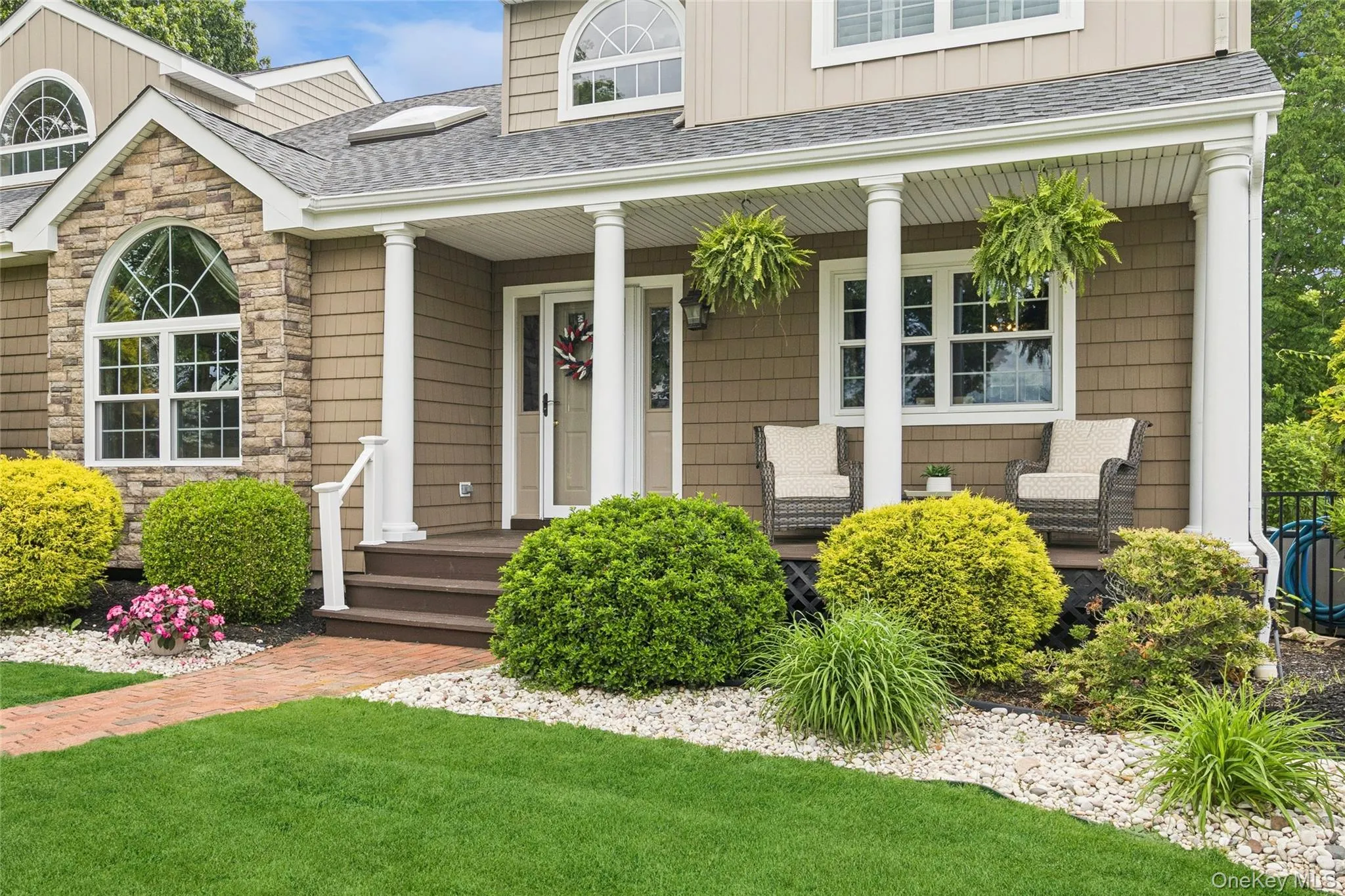 Front of home featuring a patio seating area Front of home featuring a patio seating area