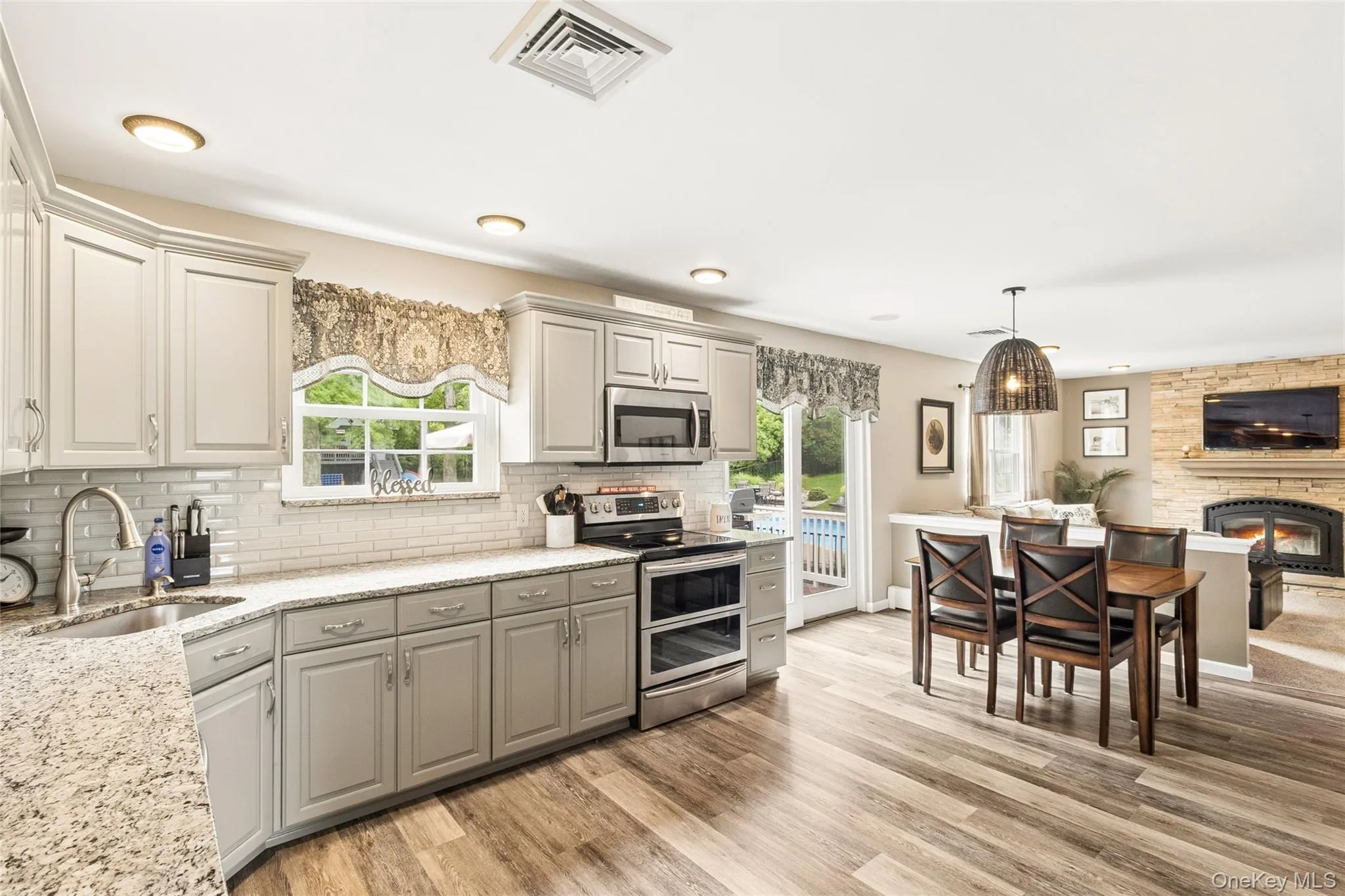 Kitchen featuring an eat-in table and living room Kitchen featuring an eat-in table and living room