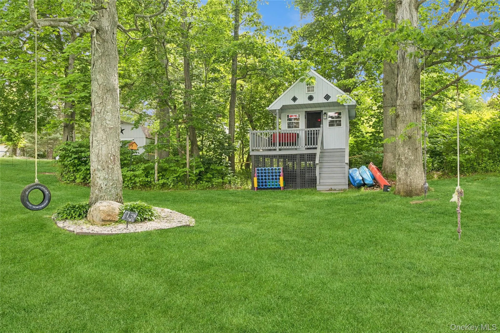 Back yard featuring a tree house Back yard featuring a tree house