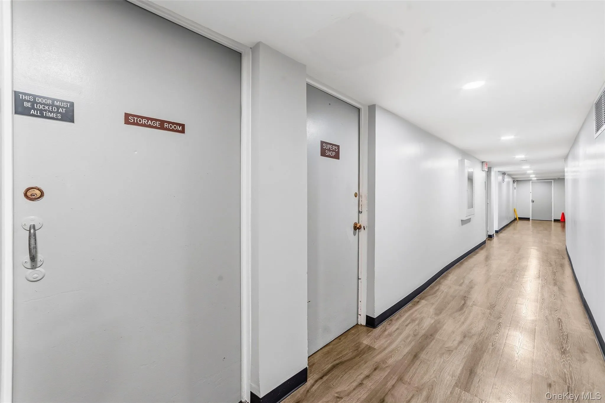 Basement with plenty of lighting and storage room. Basement with plenty of lighting and storage room.