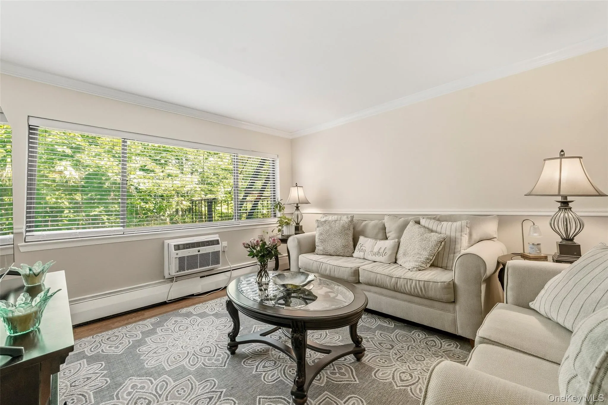 Living room featuring a large windows that provide a beautiful view and plenty of sunlight! Living room featuring a large windows that provide a beautiful view and plenty of sunlight!