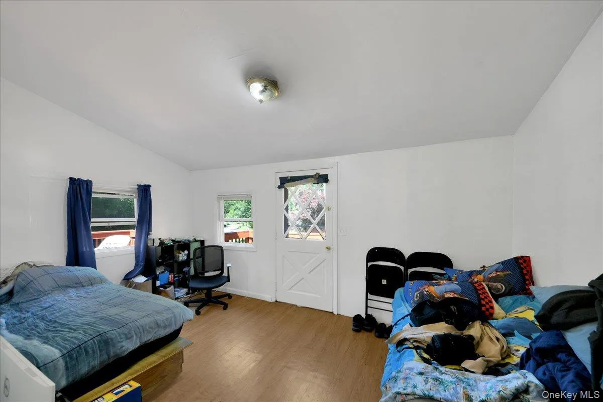 Room off the kitchen being used as a bedroom. Leads to the deck Room off the kitchen being used as a bedroom. Leads to the deck