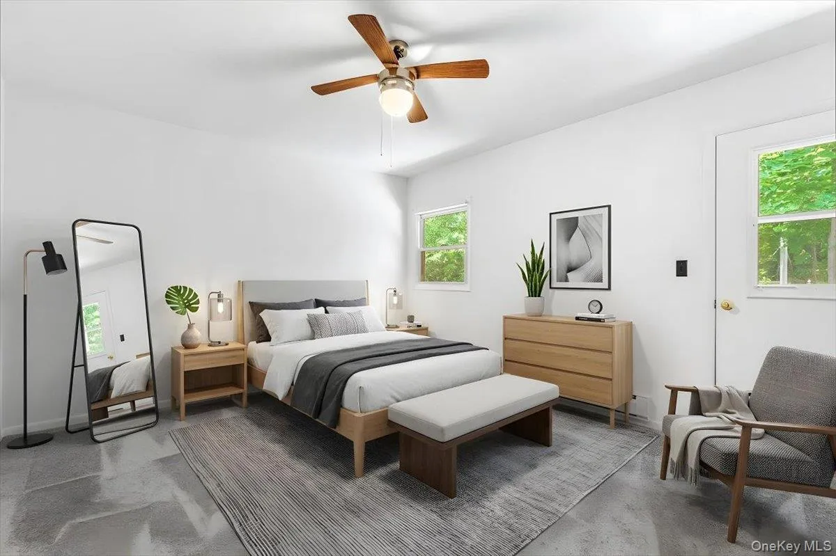 A comfortable bedroom with space for additional furnishings or a quiet sitting area A comfortable bedroom with space for additional furnishings or a quiet sitting area