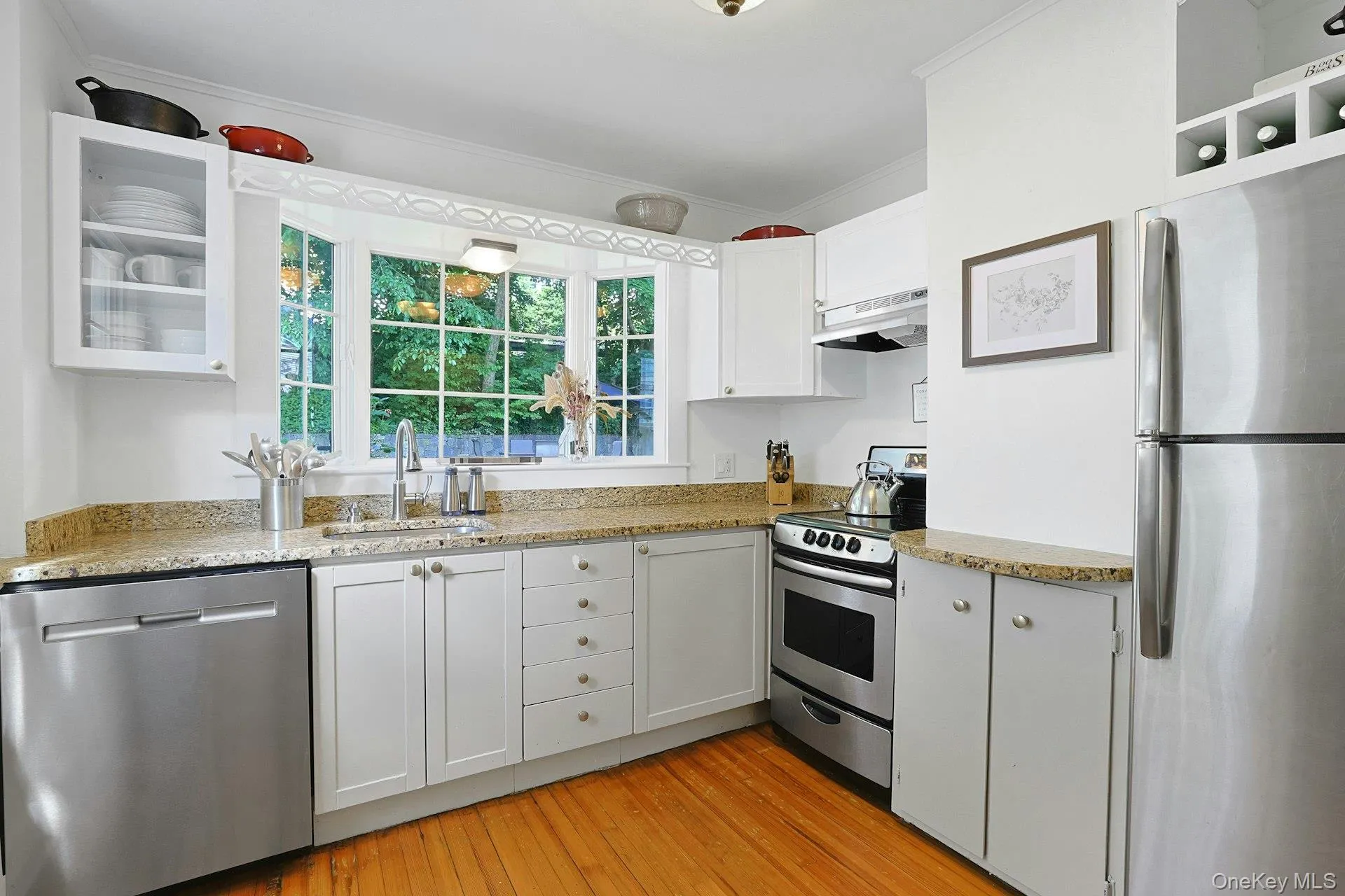 Updated kitchen featuring granite countertops, stainless steel appliances and a bay window overlooking the backyard. Updated kitchen featuring granite countertops, stainless steel appliances and a bay window overlooking the backyard.