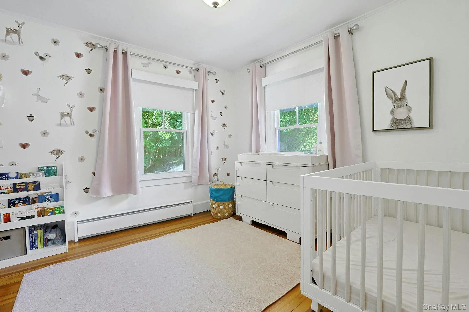 Sweet bedroom with double exposed windows and hardwood floors. Sweet bedroom with double exposed windows and hardwood floors.