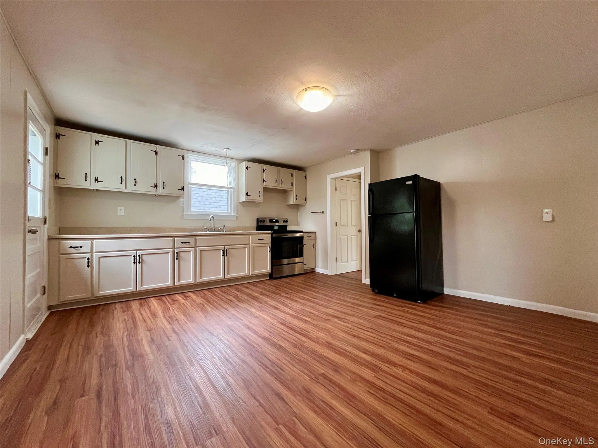 Kitchen with electric stove and refrigerator Kitchen with electric stove and refrigerator