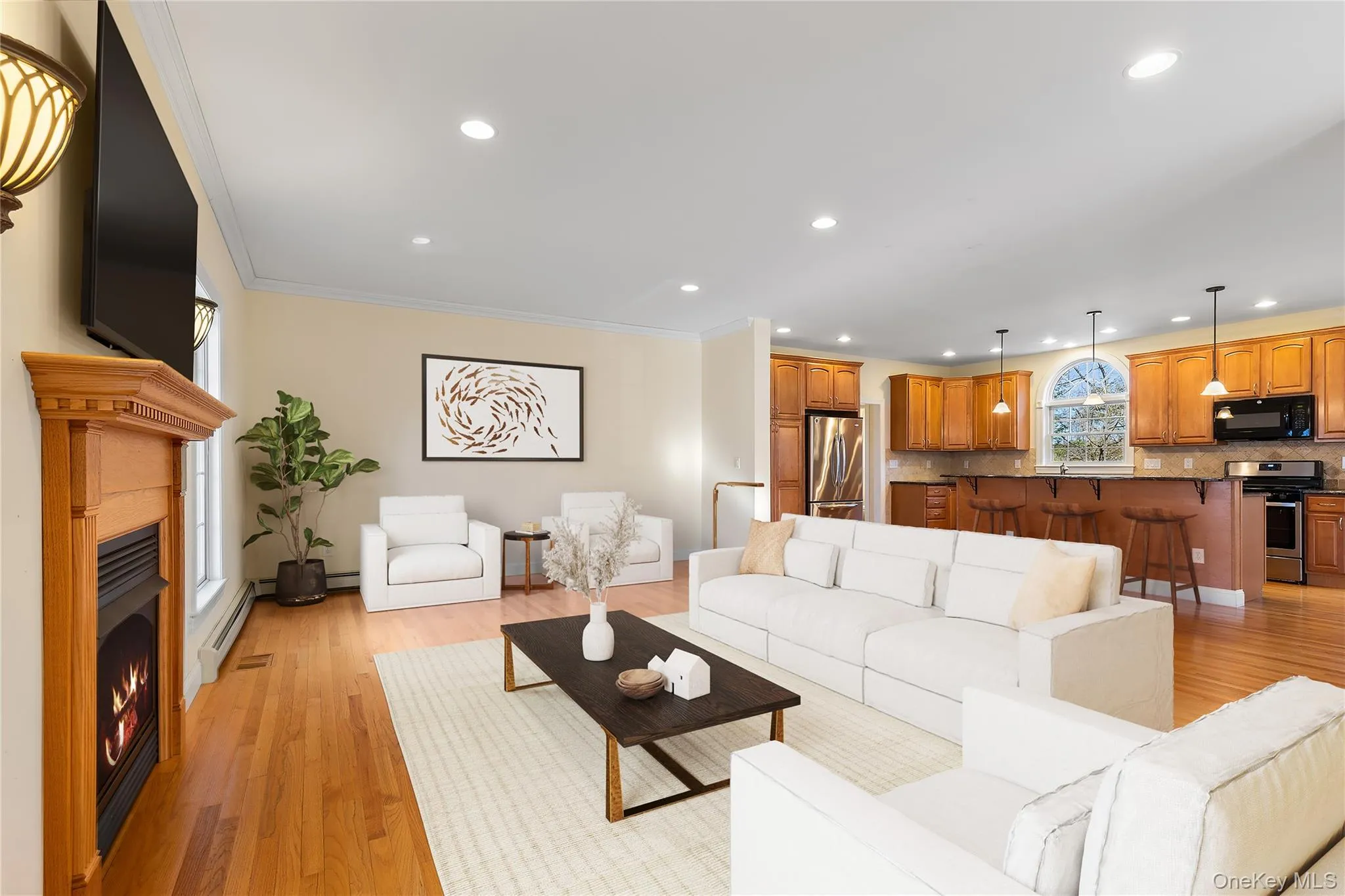 Virtually staged. Large open space living room, gas fireplace open to the kitchen and more Virtually staged. Large open space living room, gas fireplace open to the kitchen and more