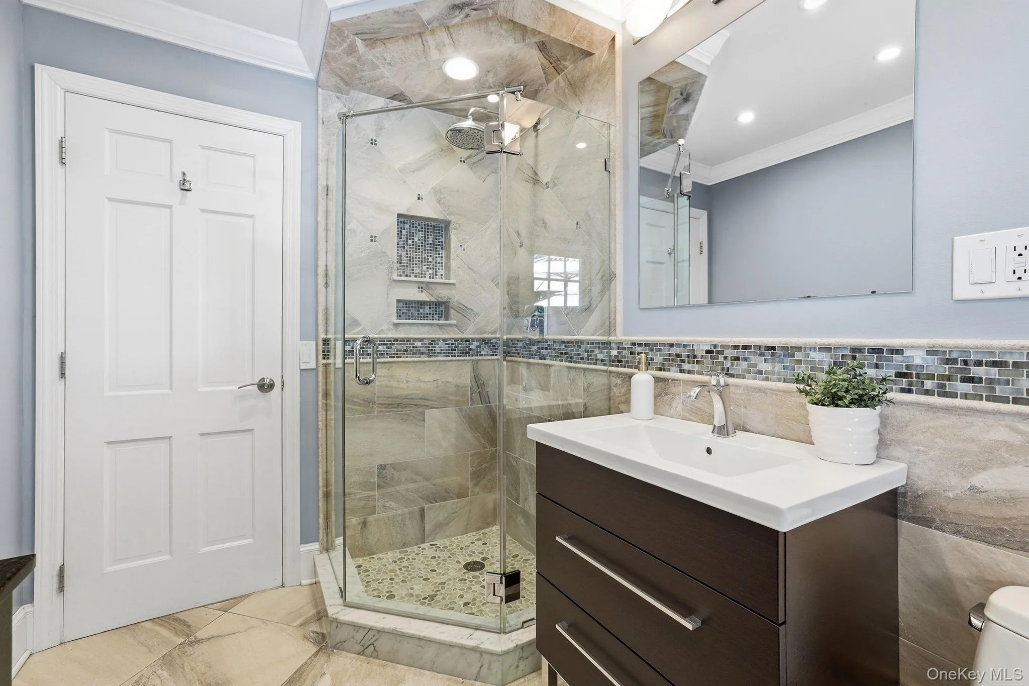 First floor full bathroom featuring a walk-in-shower First floor full bathroom featuring a walk-in-shower
