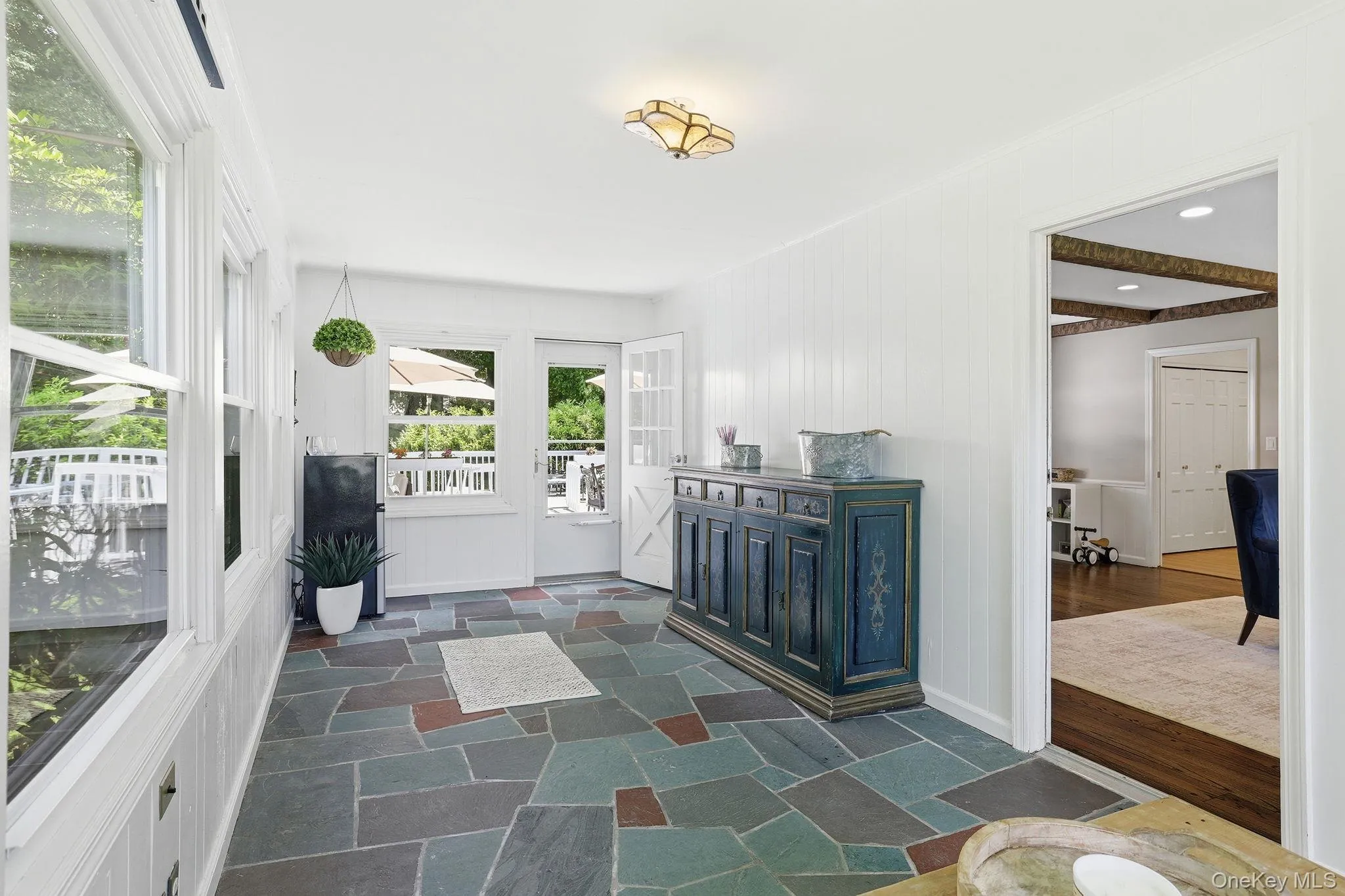 Three-season sunroom located just off the great room Three-season sunroom located just off the great room