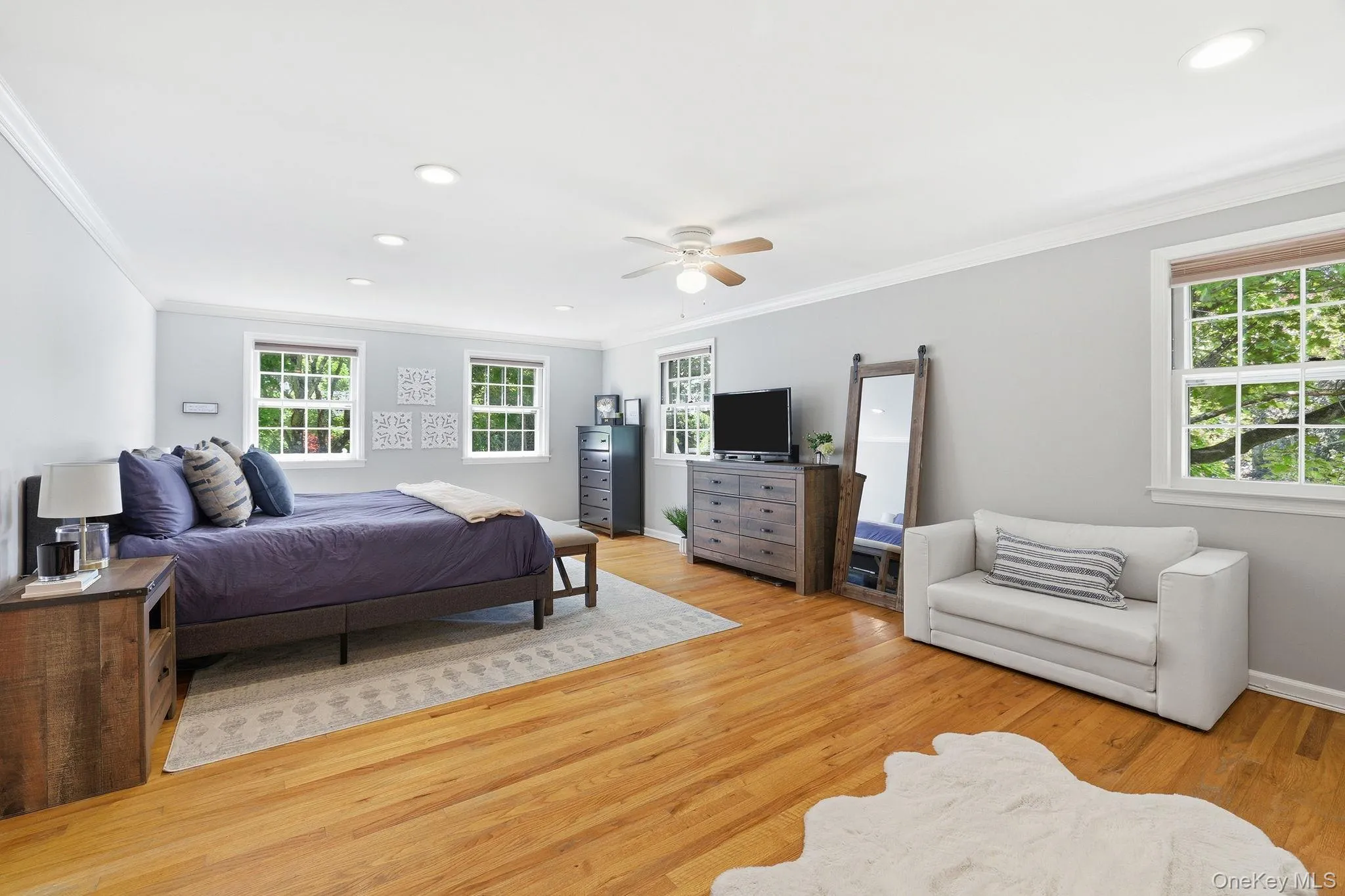 Expansive primary suite with two custom built closets and en suite bathroom Expansive primary suite with two custom built closets and en suite bathroom