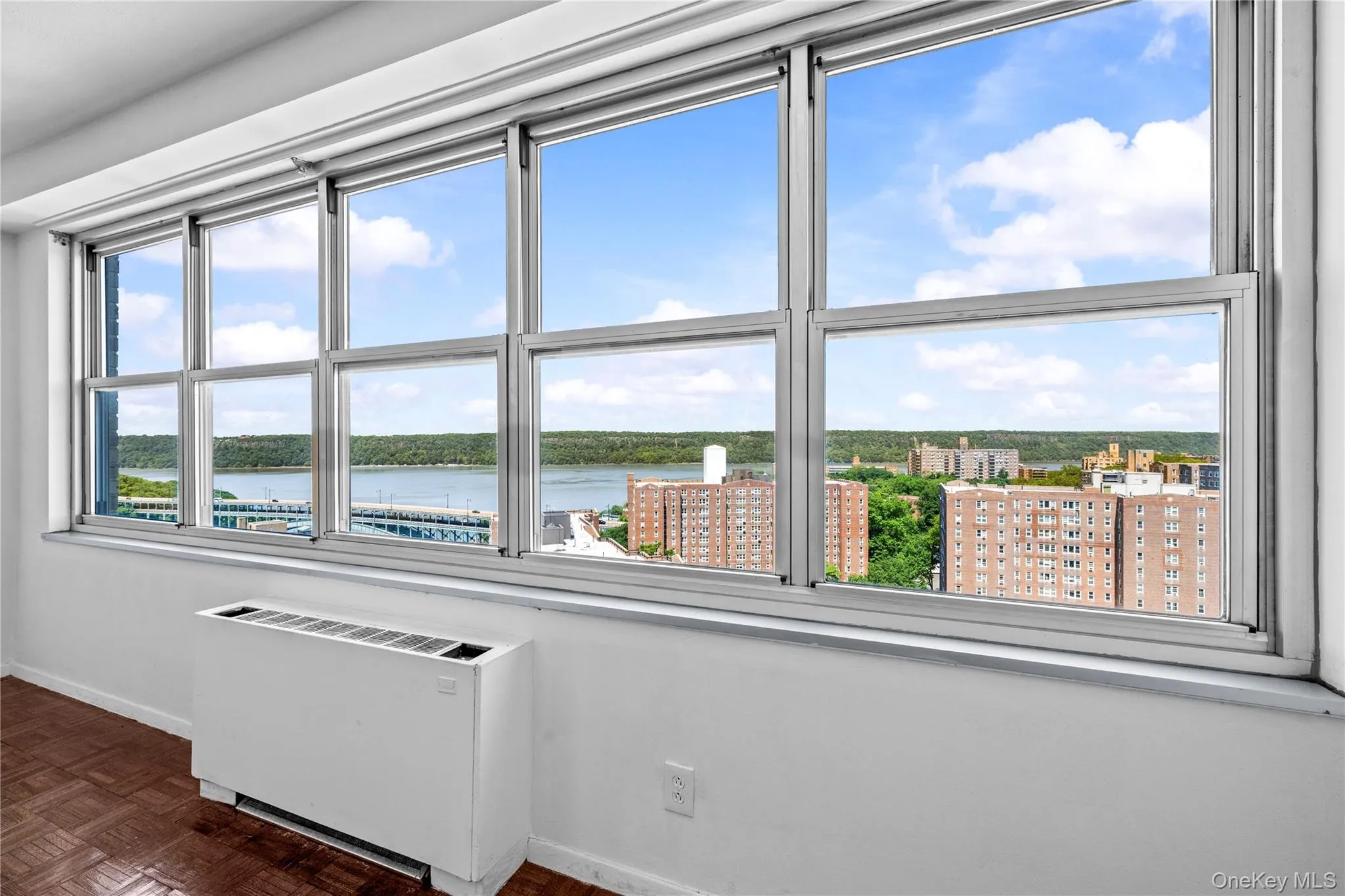 Wall of windows with high floor Hudson river views Wall of windows with high floor Hudson river views