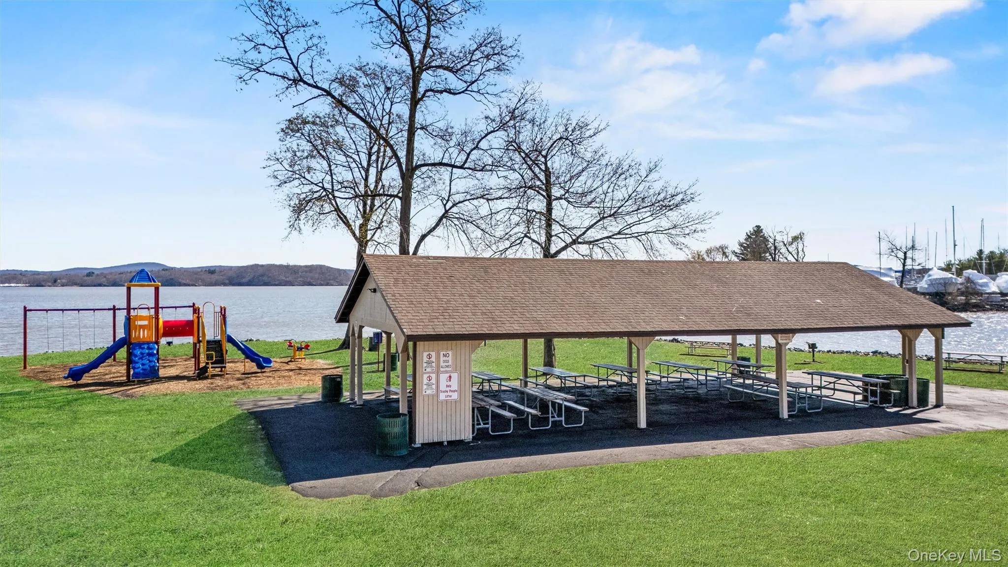 View of home's community with a yard, playground community, and a water view View of home's community with a yard, playground community, and a water view