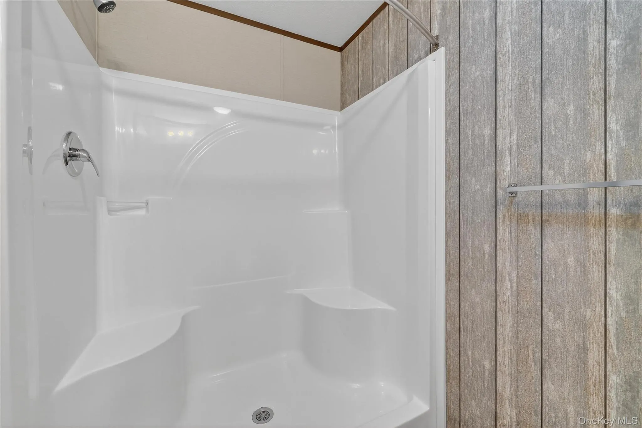 Bathroom with a shower and crown molding Bathroom with a shower and crown molding