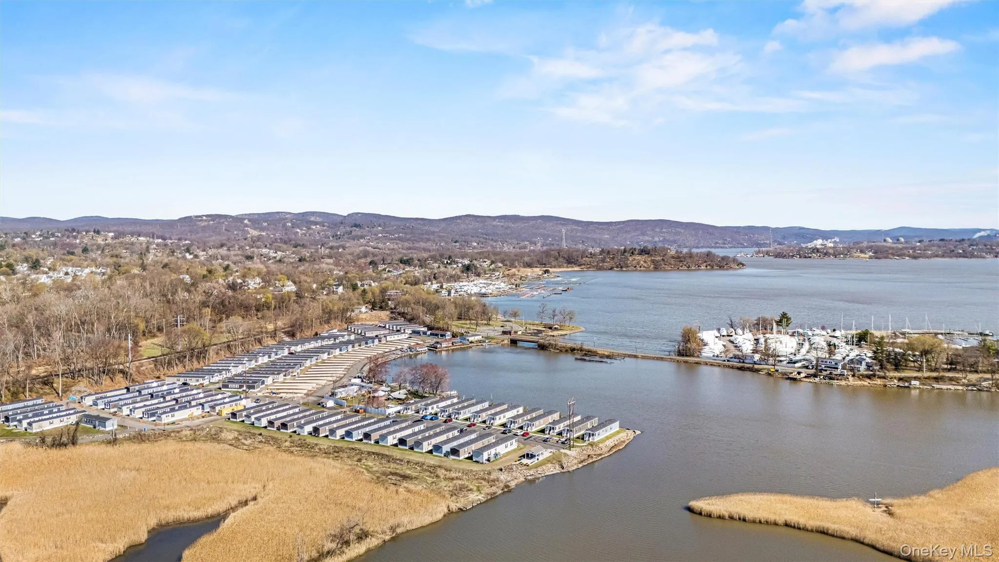 Drone / aerial view featuring a water and mountain view Drone / aerial view featuring a water and mountain view