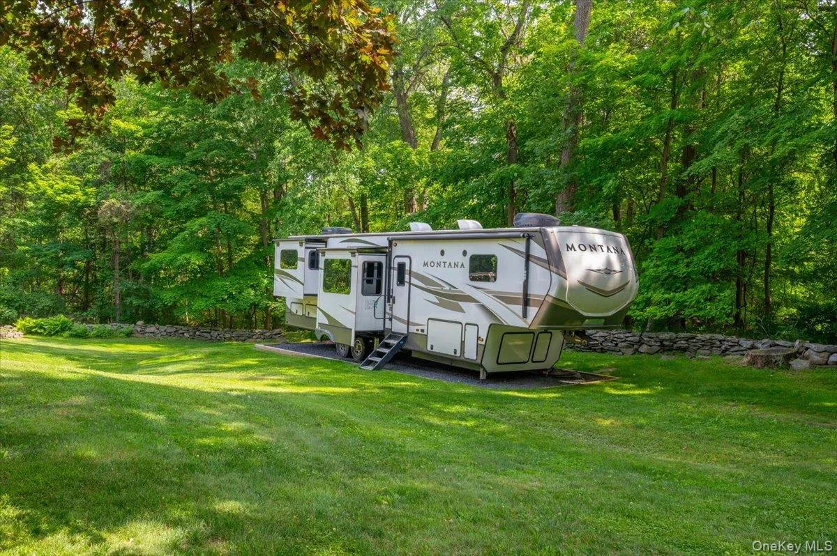 Travelers and outdoor enthusiasts will appreciate the professionally graded RV pad, complete with a dedicated 50-amp electrical hookup. Travelers and outdoor enthusiasts will appreciate the professionally graded RV pad, complete with a dedicated 50-amp electrical hookup.