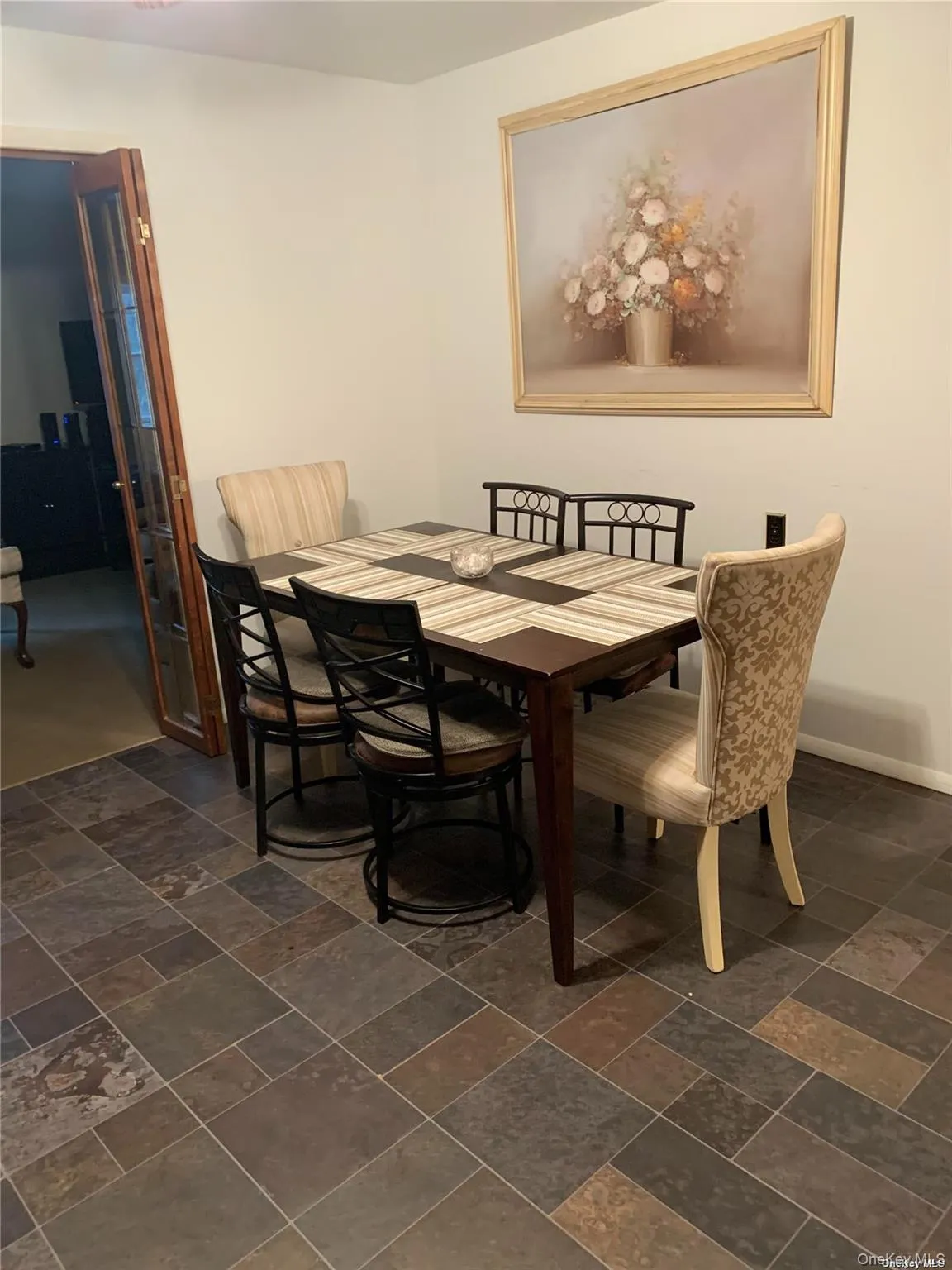 Dining area with baseboards and stone finish floor Dining area with baseboards and stone finish floor