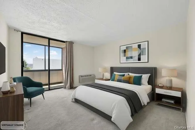 Large bedroom with sliders to outdoor terrace Large bedroom with sliders to outdoor terrace