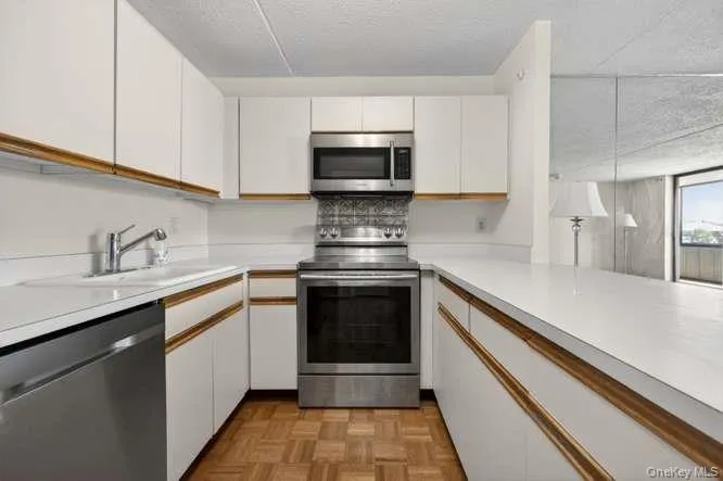 Stainless steel appliances and lots of cabinets Stainless steel appliances and lots of cabinets