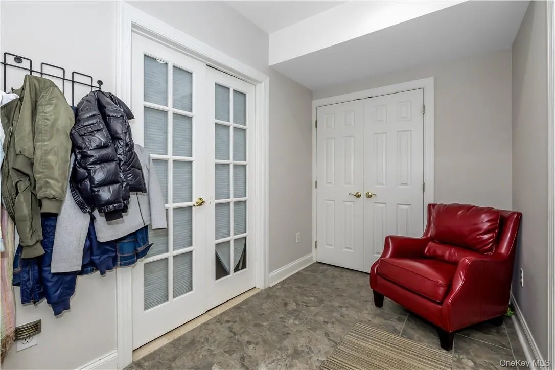 Mudroom w/ door to Garage and Door to playroom and bathroom and den / office. Mudroom w/ door to Garage and Door to playroom and bathroom and den / office.