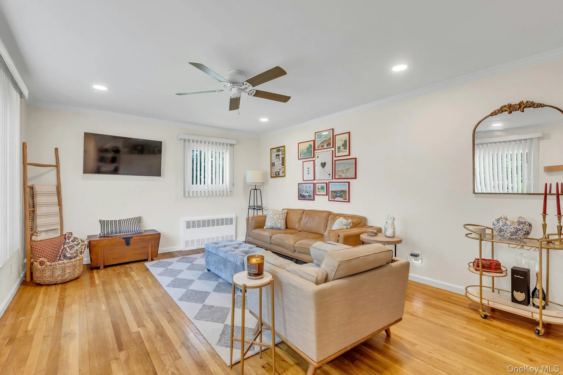 Hardwood flooring complements the bright wall tones in this living space Hardwood flooring complements the bright wall tones in this living space