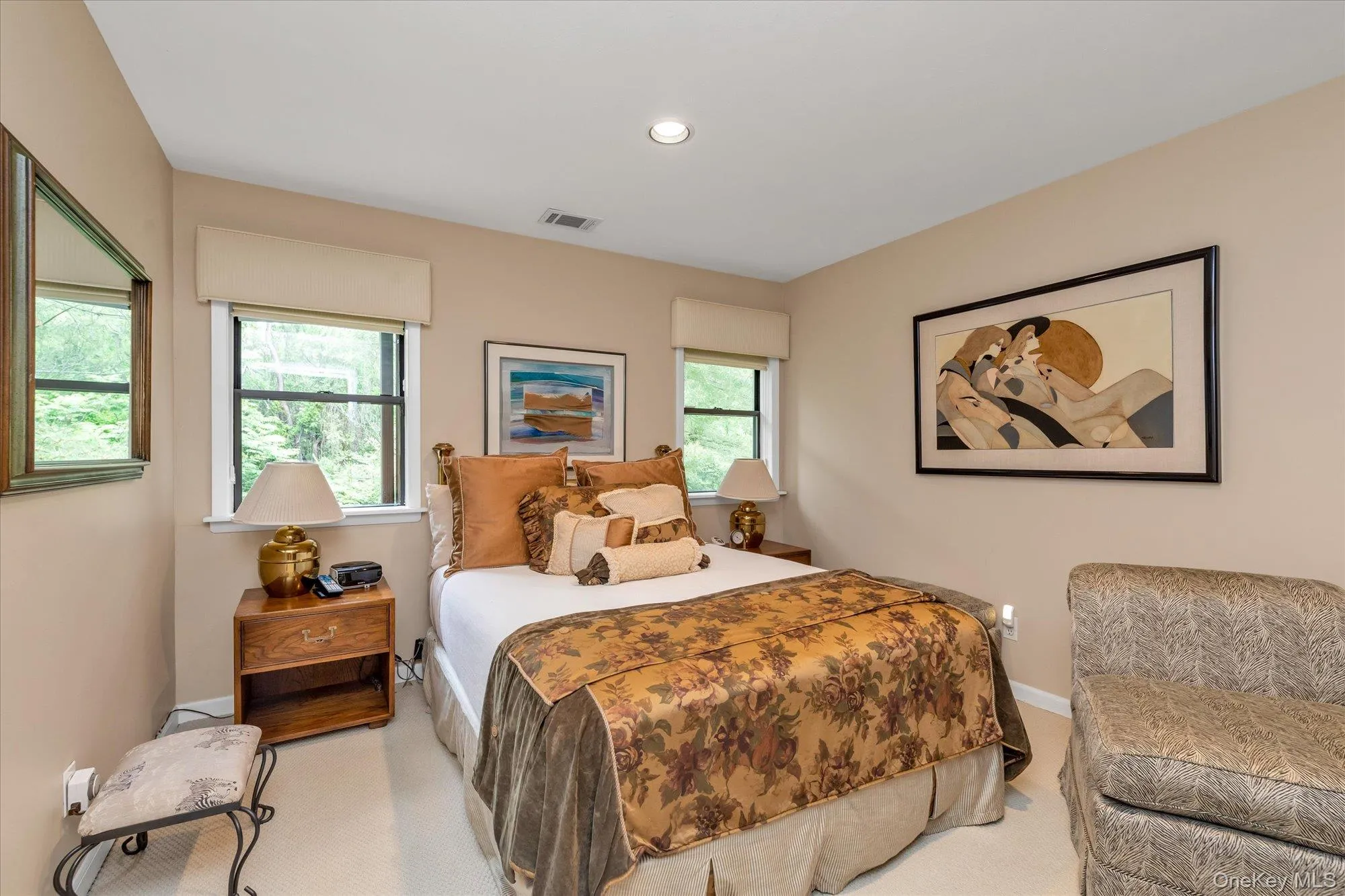 Bedroom with recessed ceiling lighting illuminating the light-toned walls and plush carpet flooring Bedroom with recessed ceiling lighting illuminating the light-toned walls and plush carpet flooring