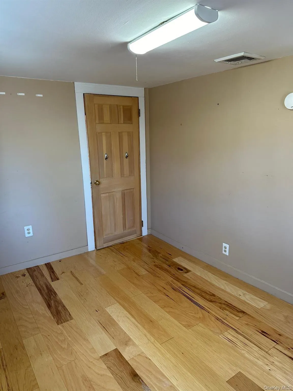 Unfurnished room featuring light wood-style vinyl floors Unfurnished room featuring light wood-style vinyl floors