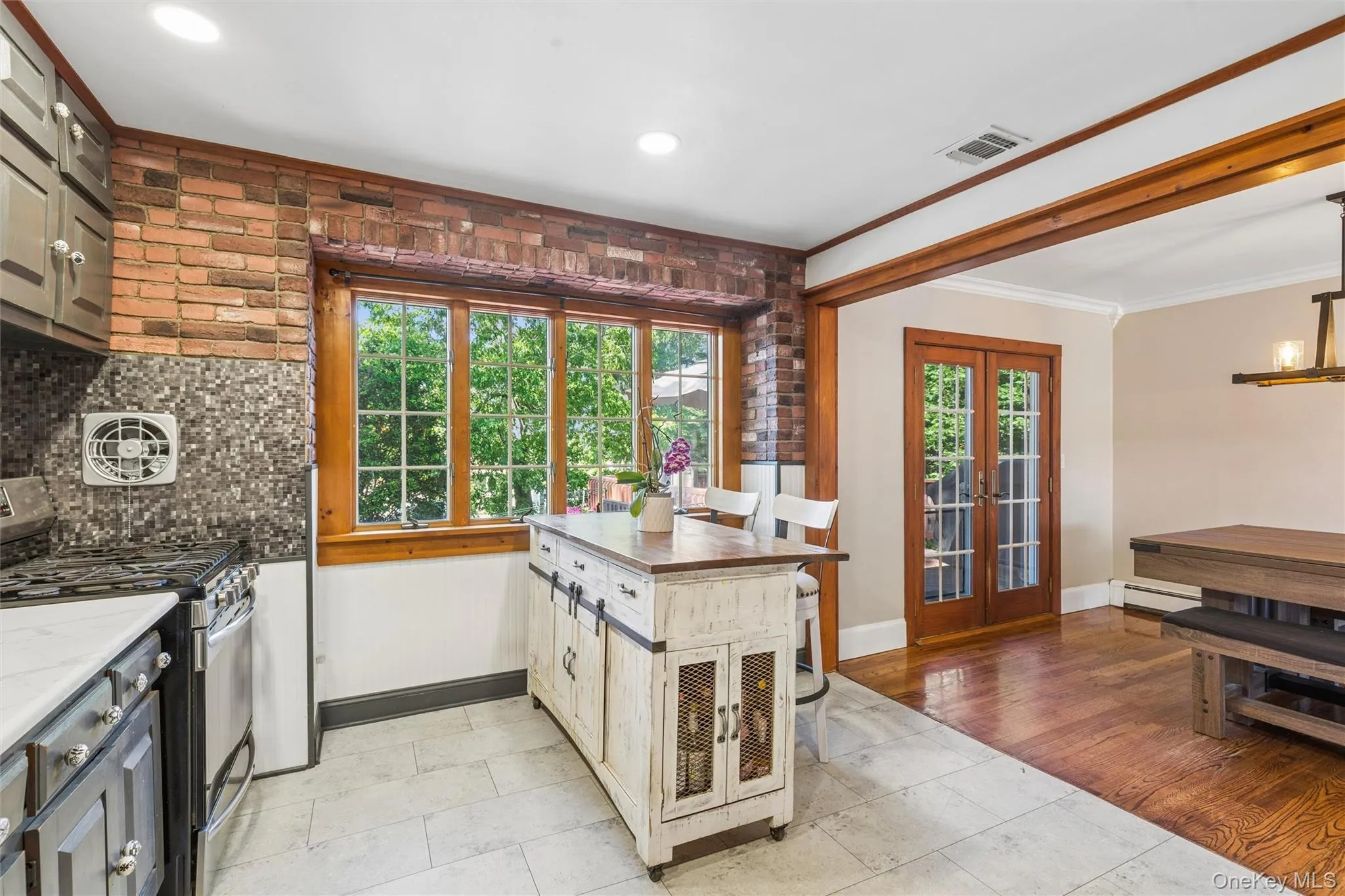 Open kitchen into expanisive dining room and french doors that lead to upper deck Open kitchen into expanisive dining room and french doors that lead to upper deck