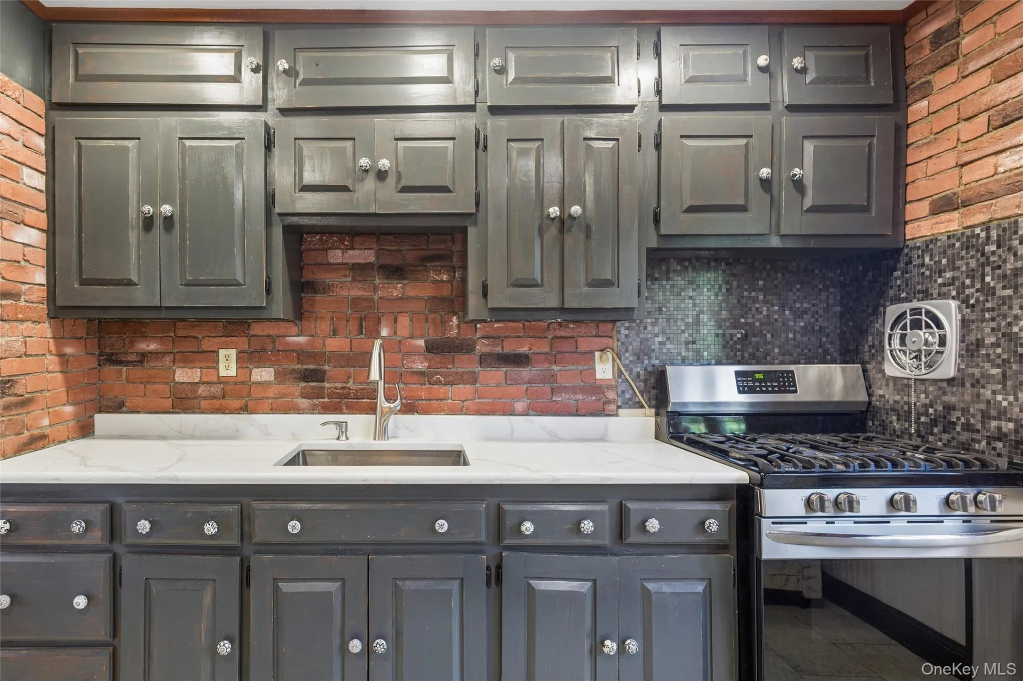 Beautiful cabinetry with bright quartz countertop Beautiful cabinetry with bright quartz countertop