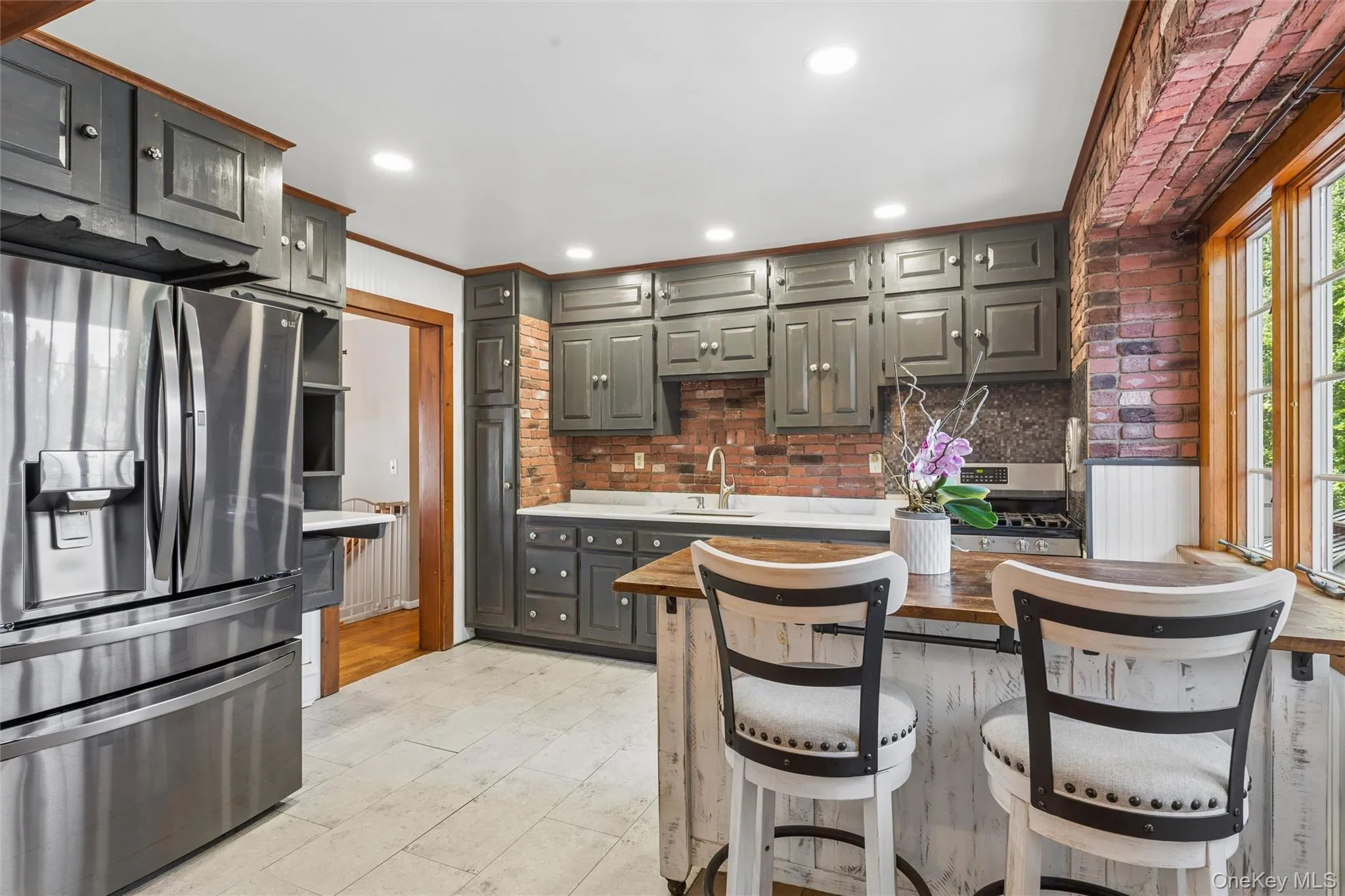 Gorgeous light filled eat in kitchen with stainless steel appliances Gorgeous light filled eat in kitchen with stainless steel appliances