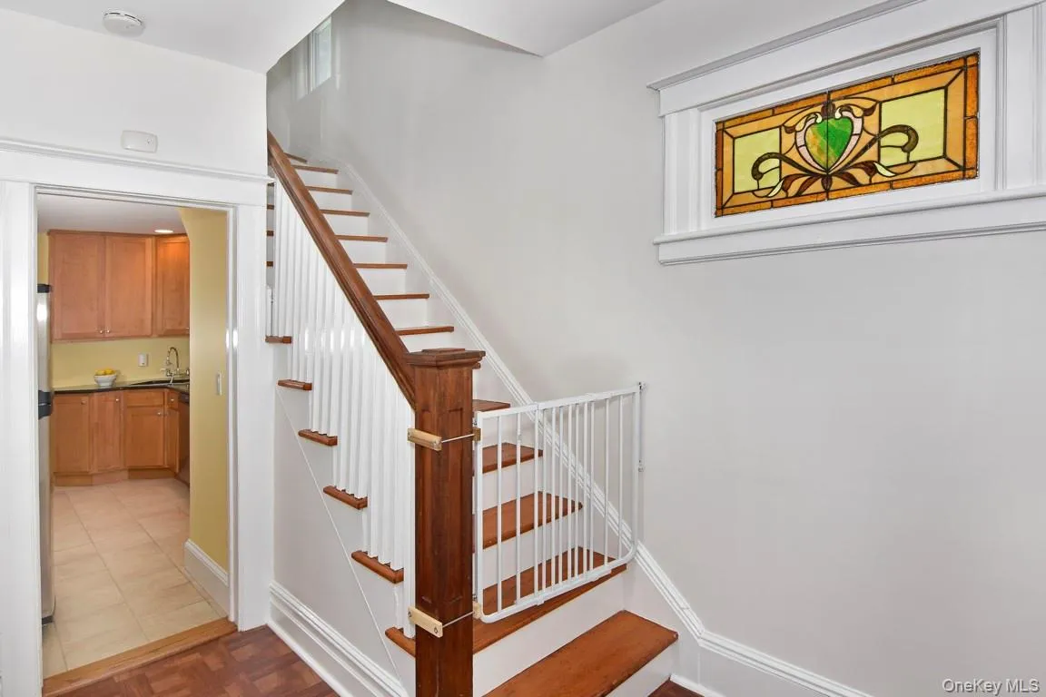 Entrance hall anchored by stairwell. Entrance hall anchored by stairwell.