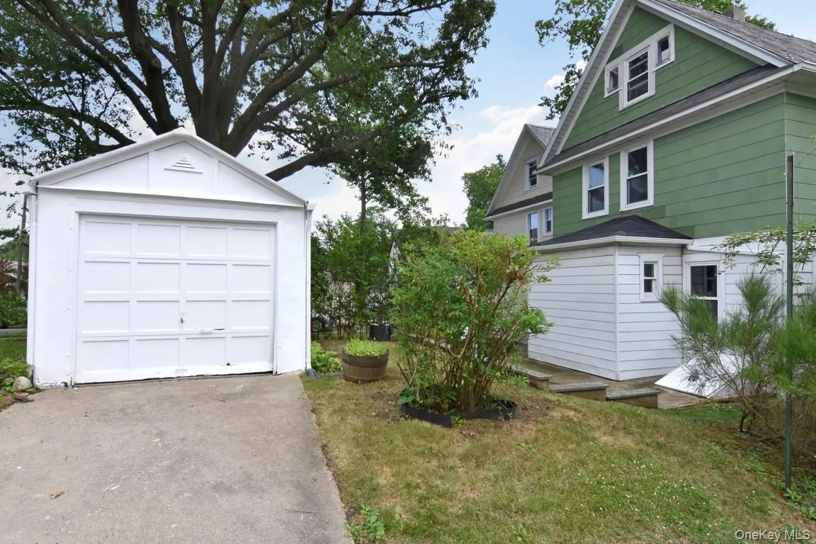 Garage and driveway view. Garage and driveway view.
