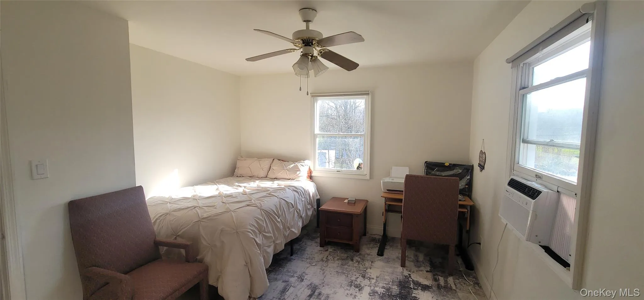 Bedroom with multiple windows and ceiling fan Bedroom with multiple windows and ceiling fan
