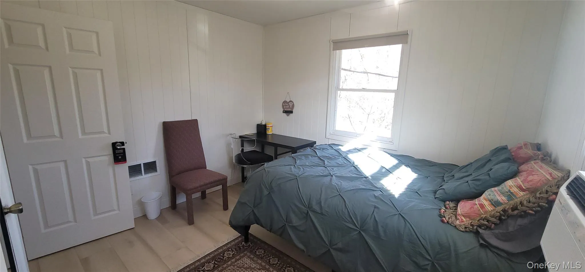 Bedroom featuring light wood finished floors Bedroom featuring light wood finished floors