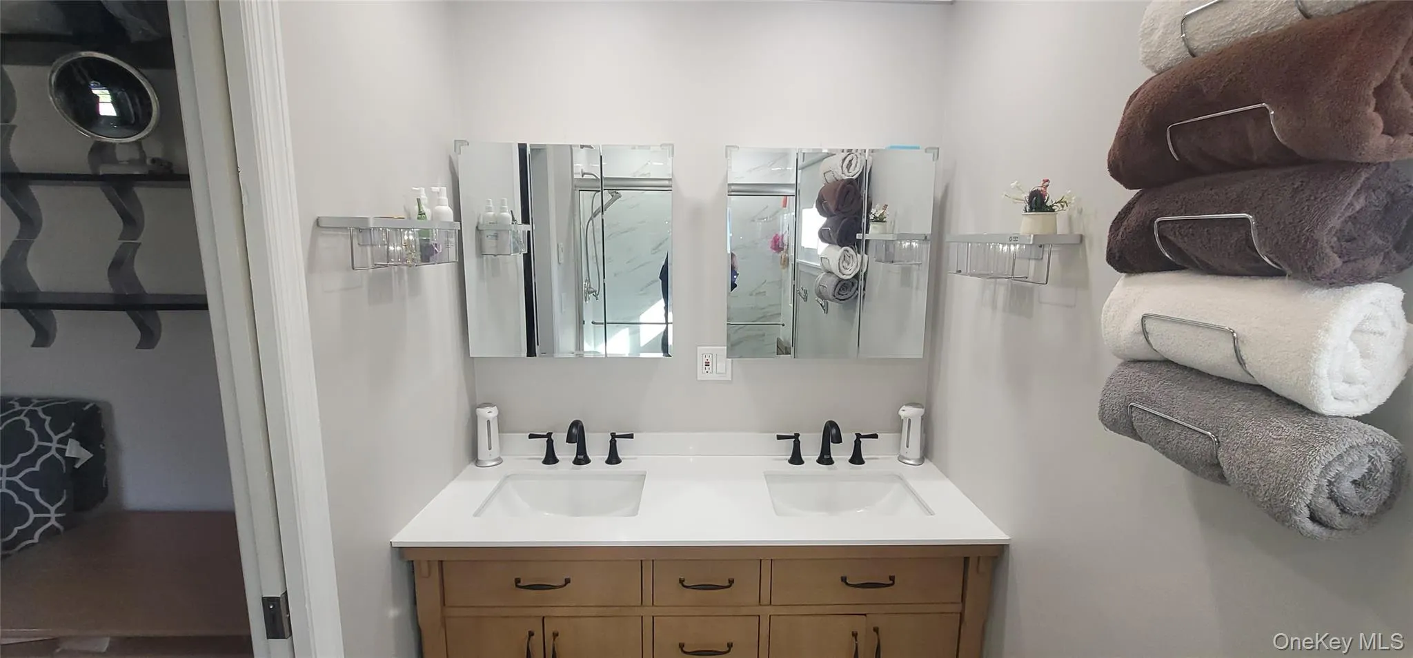 Full bath featuring a sink, double vanity, radiant flooring and a shower Full bath featuring a sink, double vanity, radiant flooring and a shower
