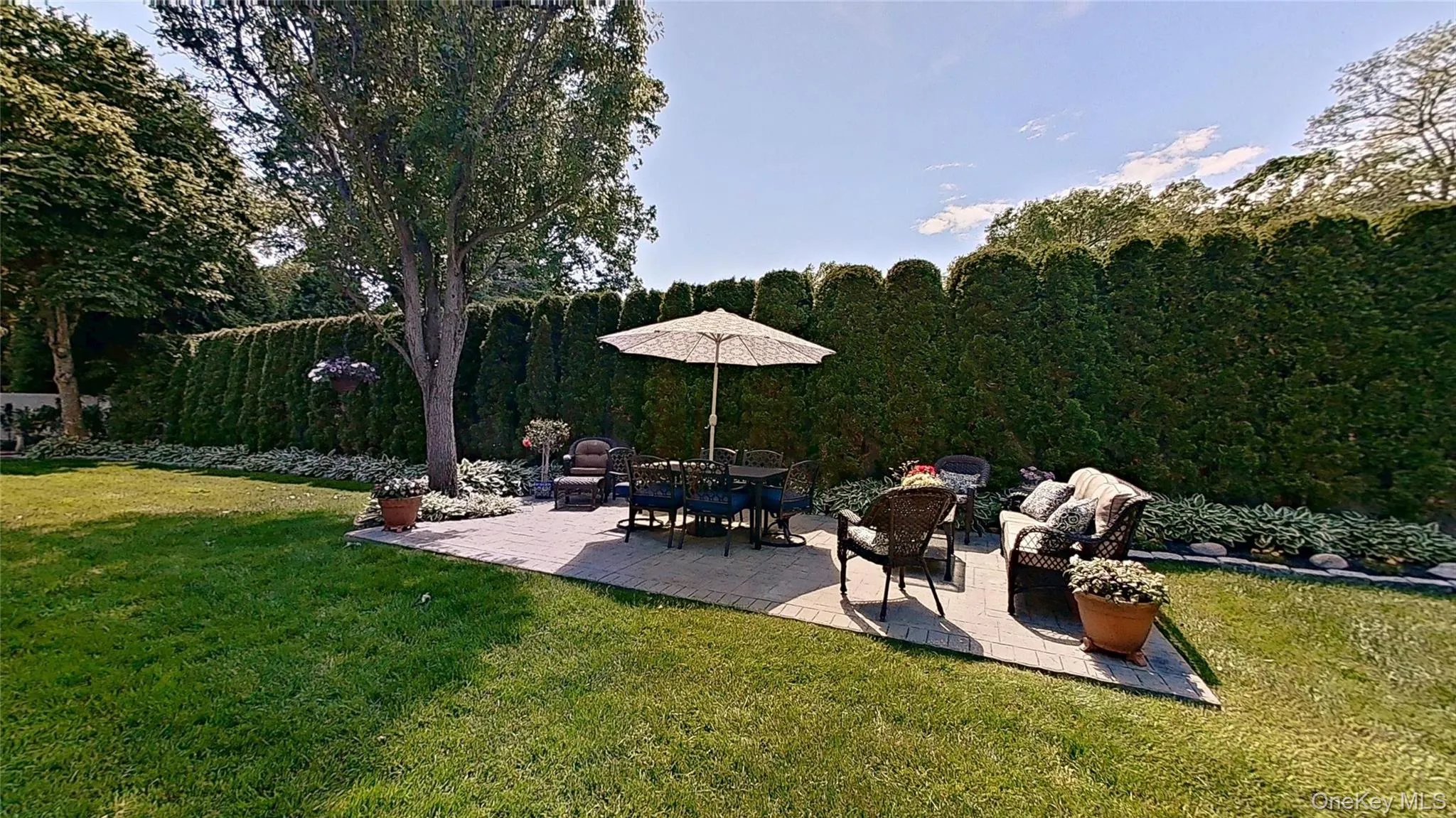 This spacious private patio in a natural setting offers a view of the landscaping and opportunities for lawn fun! This spacious private patio in a natural setting offers a view of the landscaping and opportunities for lawn fun!