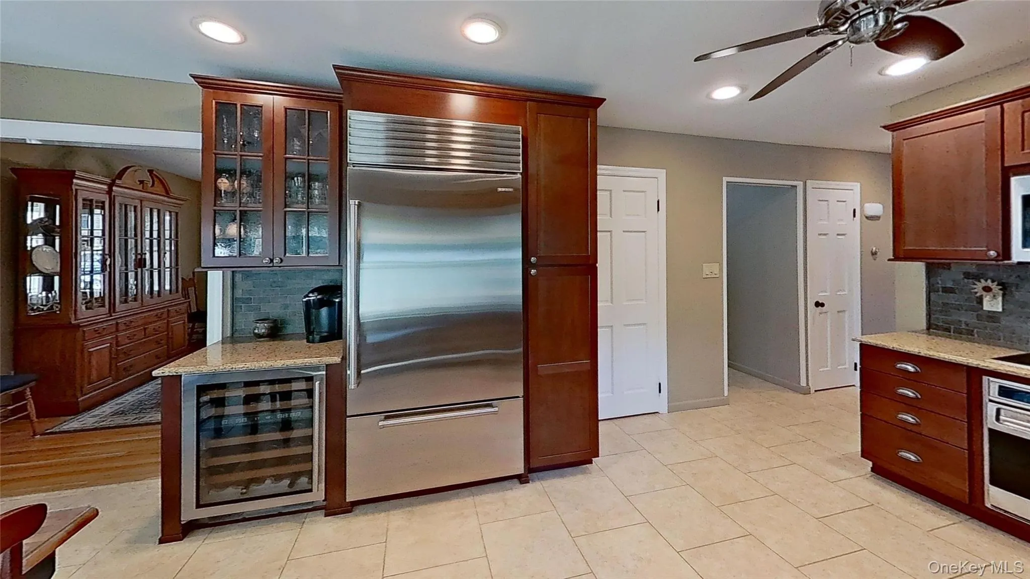 Wine cooler/bar area adds convenience to this open floor plan! Wine cooler/bar area adds convenience to this open floor plan!