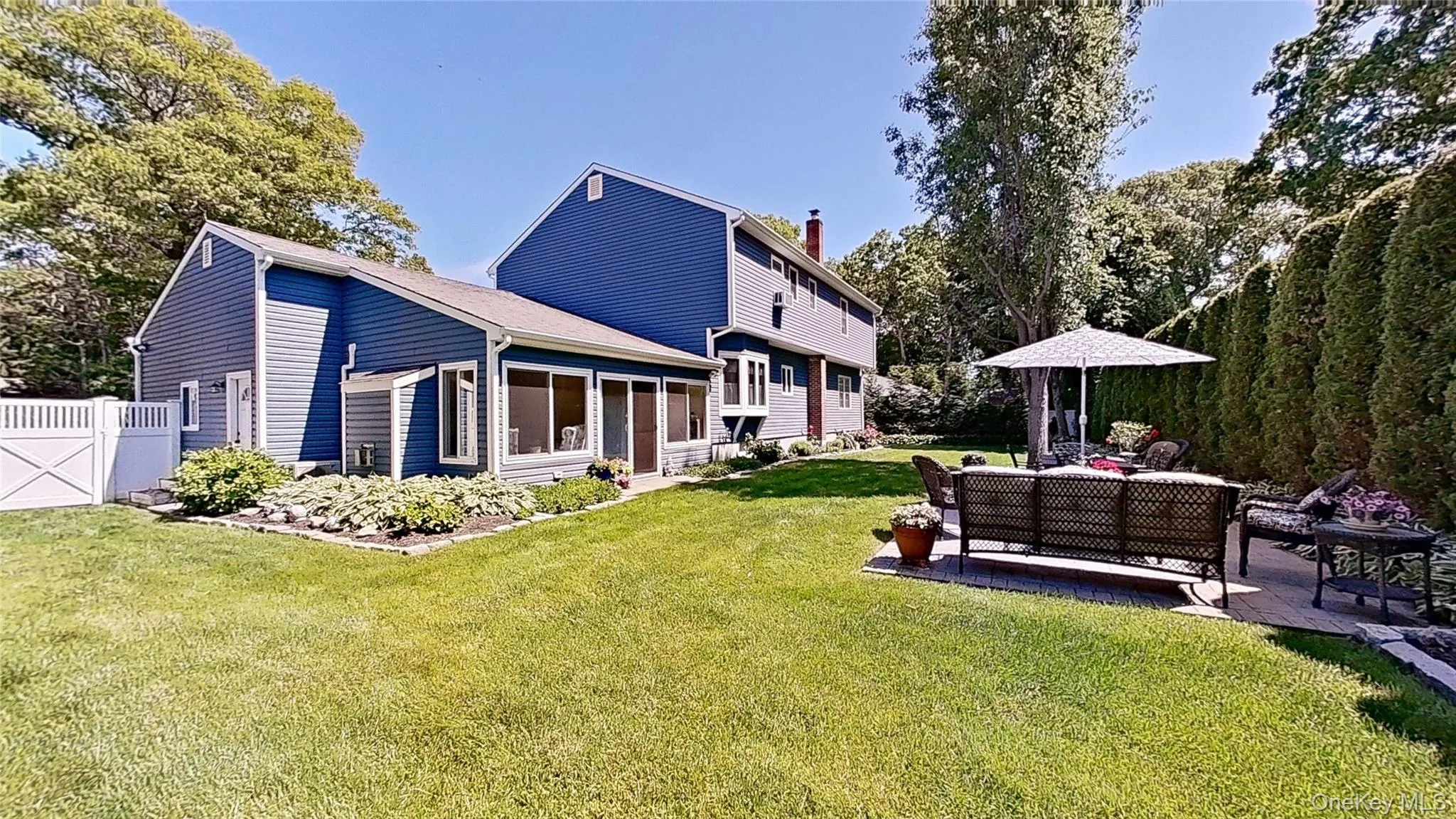a Private backyard with natural beauty surrounding this stately home! a Private backyard with natural beauty surrounding this stately home!