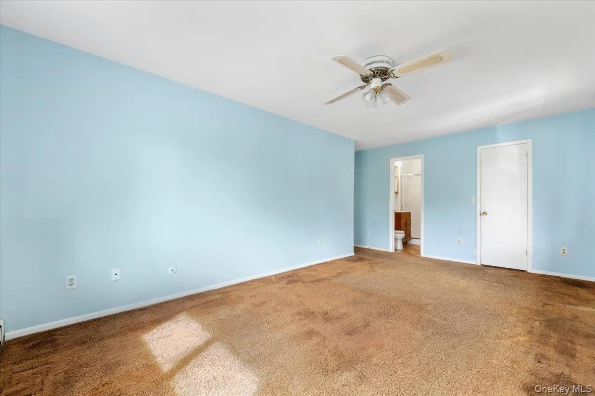 with full bath and walk in closet with full bath and walk in closet