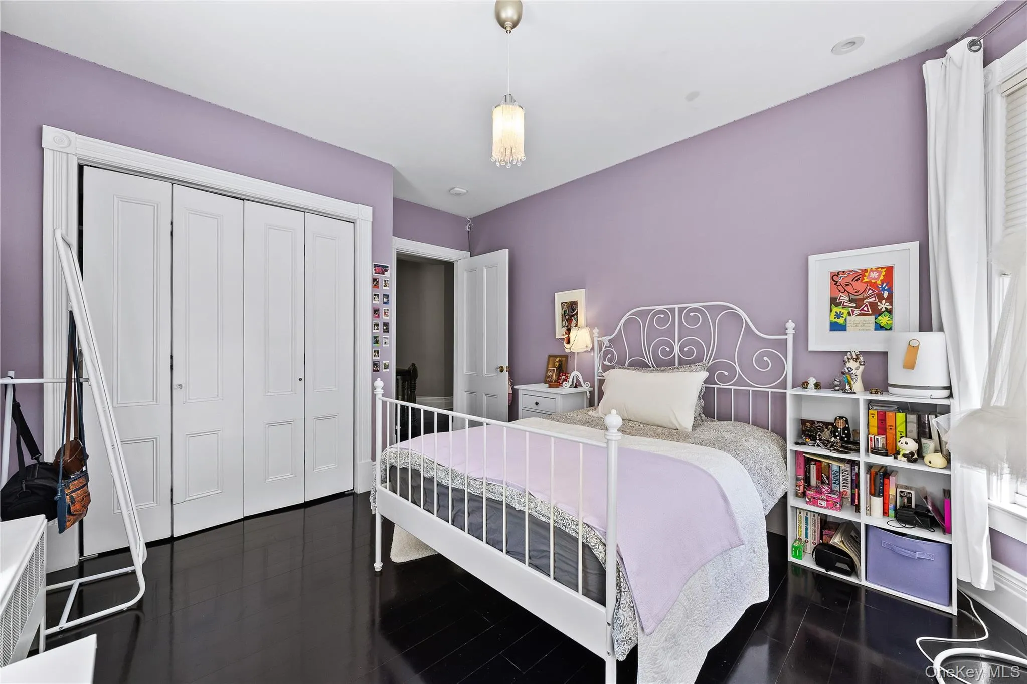 Dark-finish wood flooring complements light lavender walls Dark-finish wood flooring complements light lavender walls