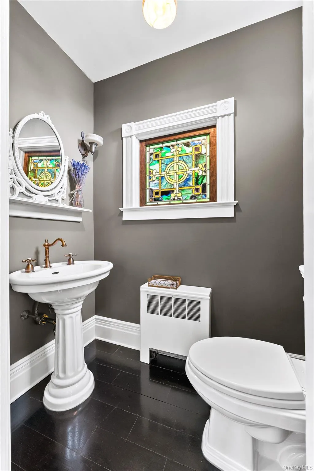 Half bathroom right outside formal dining area and kitchen. Half bathroom right outside formal dining area and kitchen.