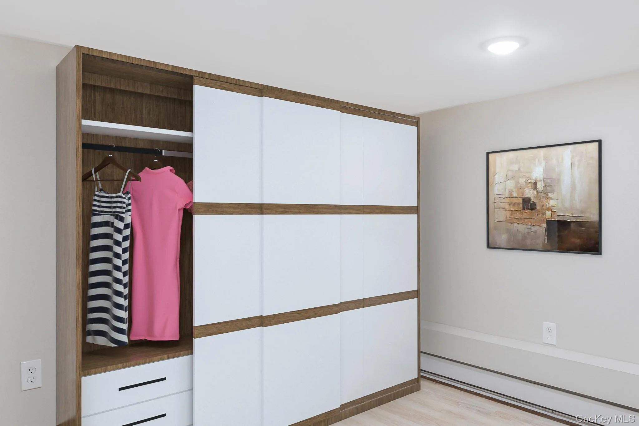 Custom wood-finish closet system featuring white sliding doors, integrated shelving, and two built-in drawers Custom wood-finish closet system featuring white sliding doors, integrated shelving, and two built-in drawers