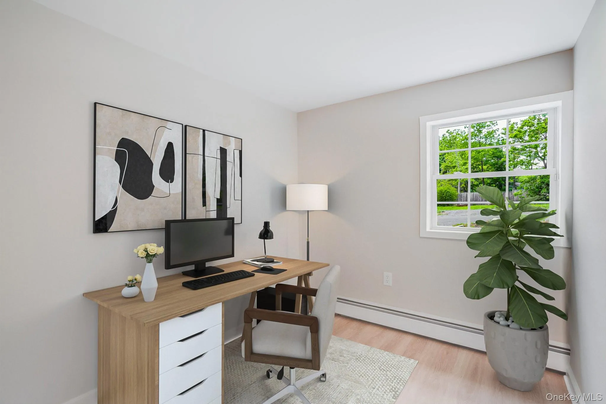 Room featuring light-toned walls and wood-finish flooring Room featuring light-toned walls and wood-finish flooring