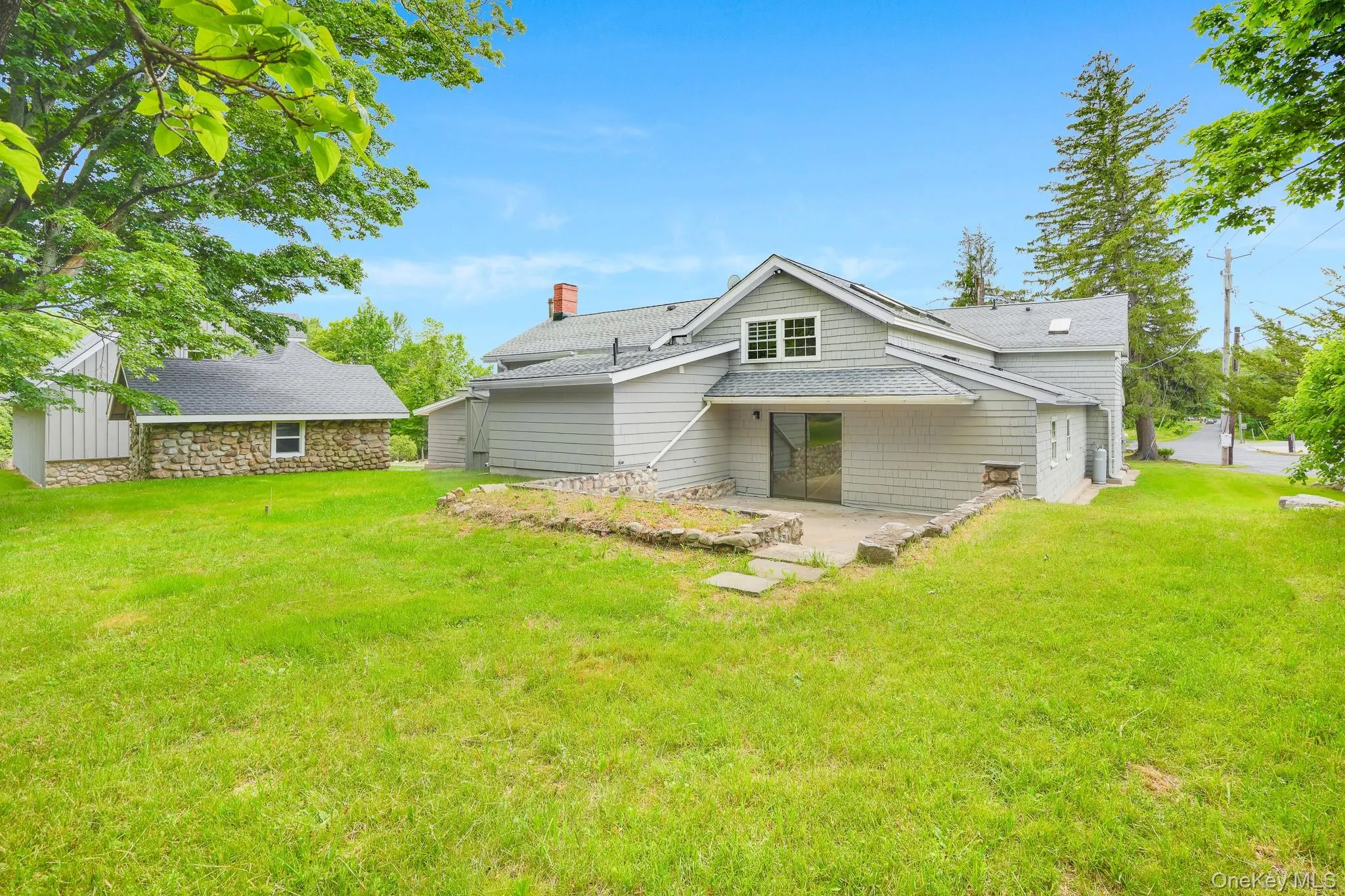 Expansive green lawn surrounds the property Expansive green lawn surrounds the property